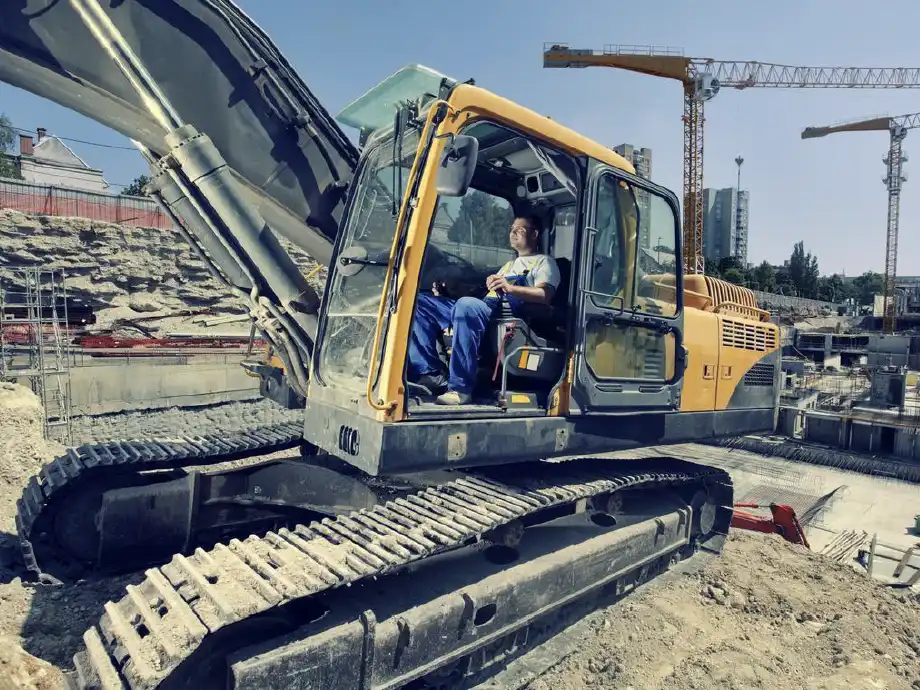 Man in sitting in large construction machine